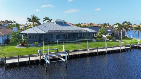 an aerial view of a house with a ocean view