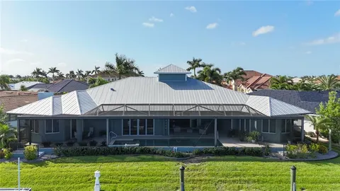 an aerial view of a house with a ocean view