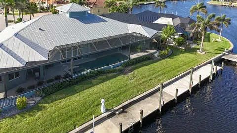an aerial view of a house with a swimming pool