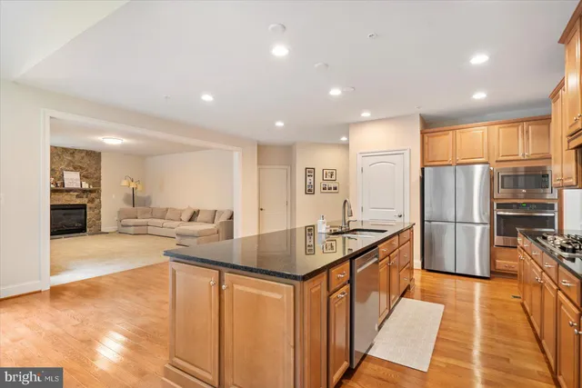 a view of a dining room with furniture wooden floor and chandelier
