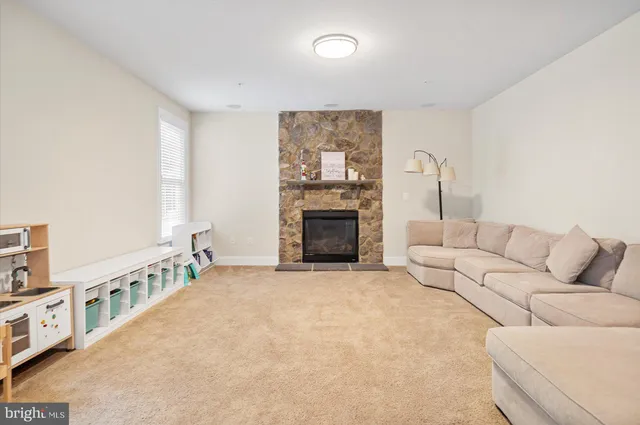a view of a hallway with wooden floor and stairs