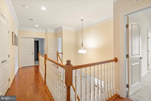 a view of walk in closet with clothes