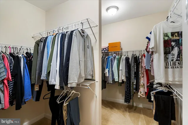 a bathroom with a granite countertop sink toilet and a mirror