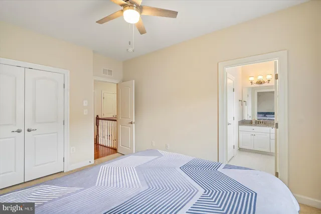 a kitchen with granite countertop a sink a counter space appliances and cabinets