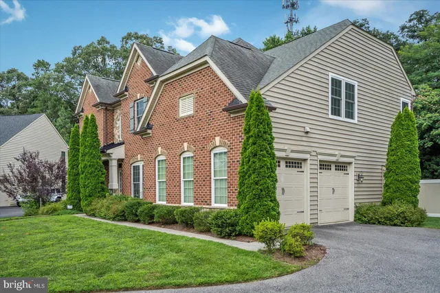 a living room with wooden floor and a table