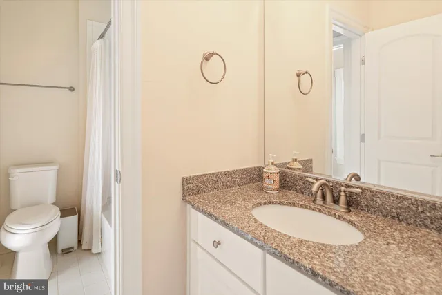 a view of a deck with two chairs and a table