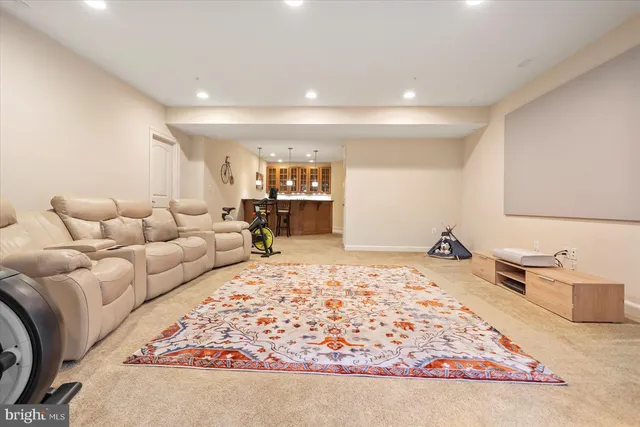 an aerial view of a house with a garden and swimming pool