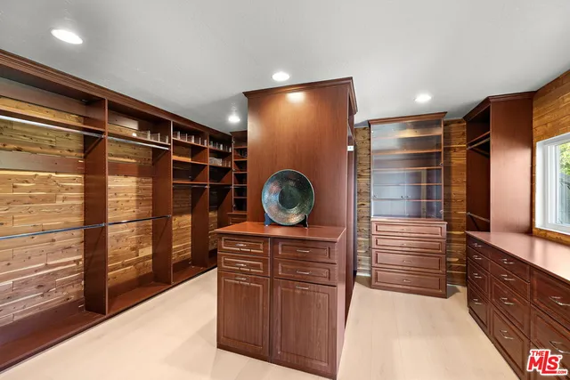 a bathroom with a sink a mirror and a shower