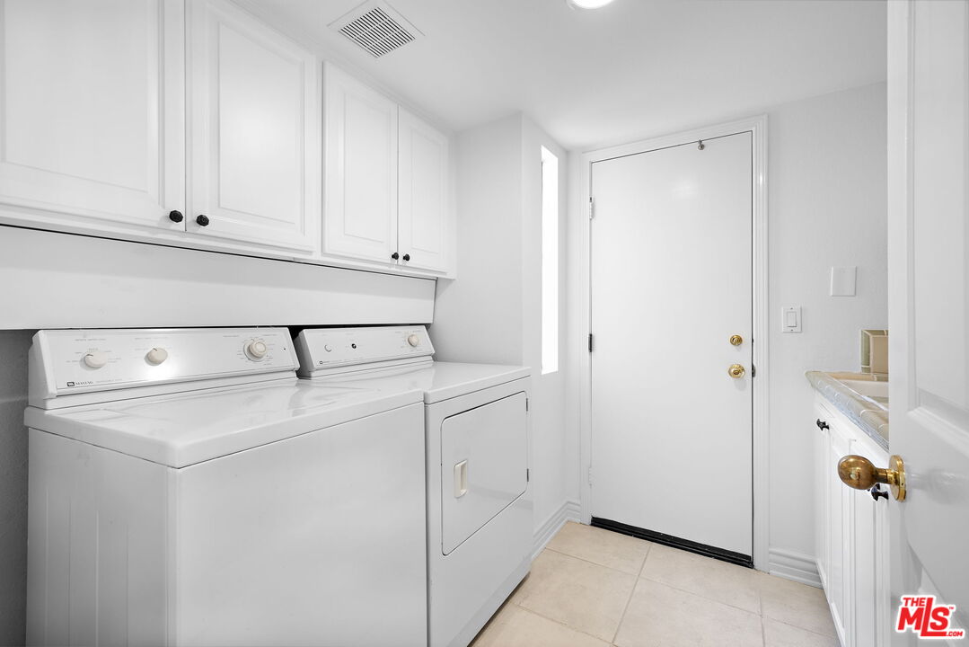 31 St Tropez Newport Beach, CA 92660 - Photo 16 of 22 a view of washer and dryer