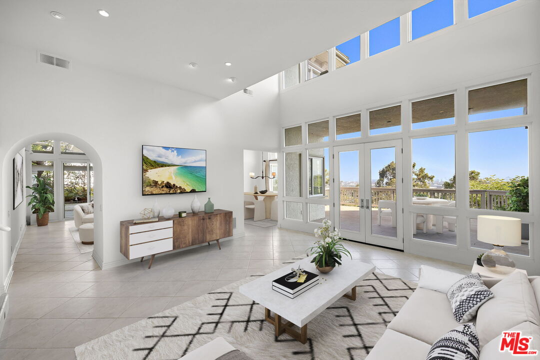 31 St Tropez Newport Beach, CA 92660 - Photo 3 of 22 a living room with furniture and wooden floor