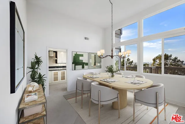 a dining room with furniture a livingroom and chandelier