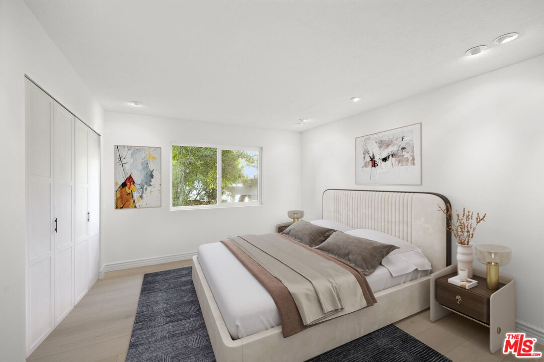 31 St Tropez Newport Beach, CA 92660 - Photo 7 of 22 a bedroom with a large bed and a window