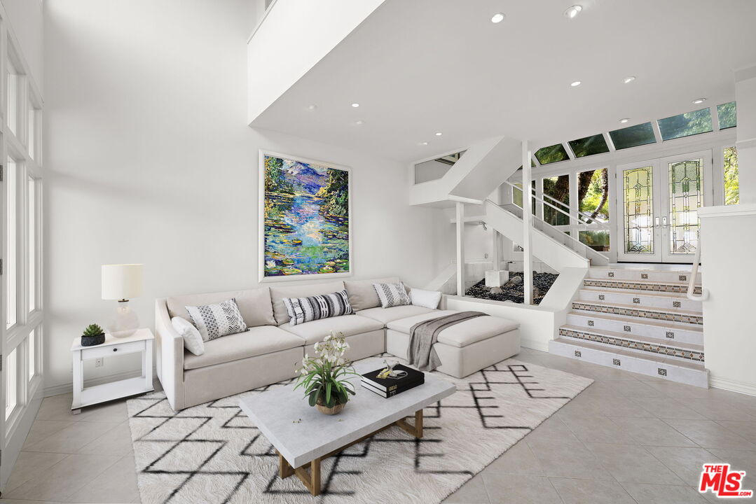 31 St Tropez Newport Beach, CA 92660 - Photo 9 of 22 a living room with furniture and wooden floor