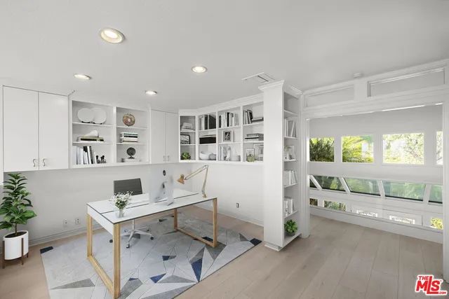 a workspace with furniture and window