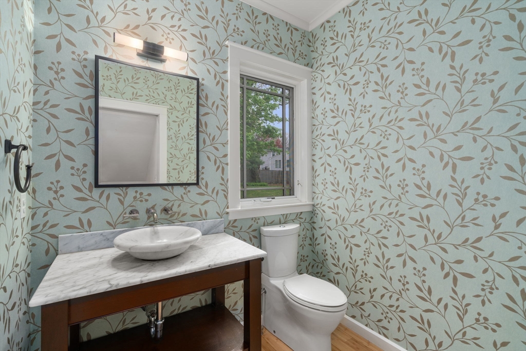 51 Avon Road Wellesley, MA 02482 - Photo 14 of 26 a bathroom with a sink a toilet and a mirror