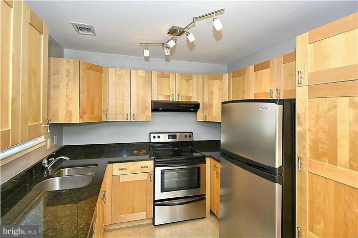 11049 Villaridge Court, Unit A Reston, VA 20191 - Photo 6 of 27 Maple Cabinets with granite counters