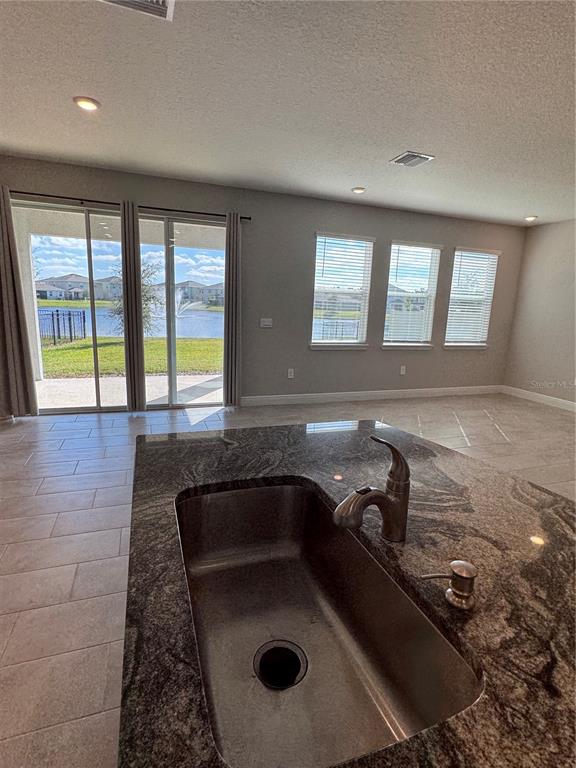 17710 Cantarina Cove Bradenton, FL 34211 - Photo 13 of 36 a bathroom with a sink and a large window