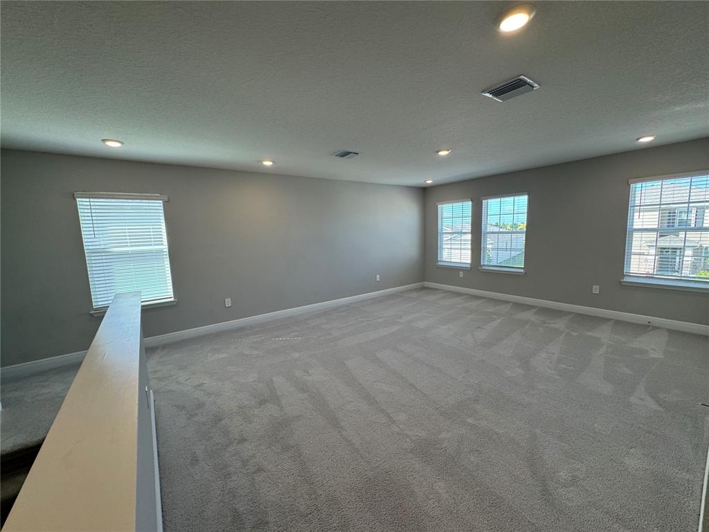 17710 Cantarina Cove Bradenton, FL 34211 - Photo 15 of 36 an empty room with windows