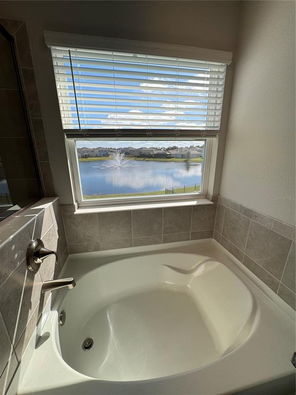 17710 Cantarina Cove Bradenton, FL 34211 - Photo 19 of 36 a bathroom with a tub