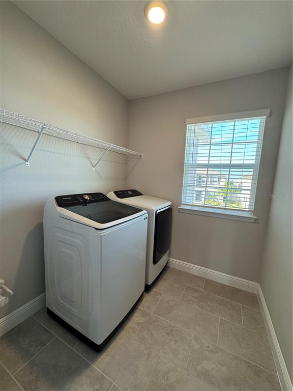 17710 Cantarina Cove Bradenton, FL 34211 - Photo 22 of 36 a utility room with dryer and washer