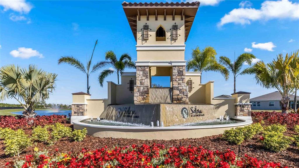 17710 Cantarina Cove Bradenton, FL 34211 - Photo 24 of 36 a view of a house with a fountain and potted plants