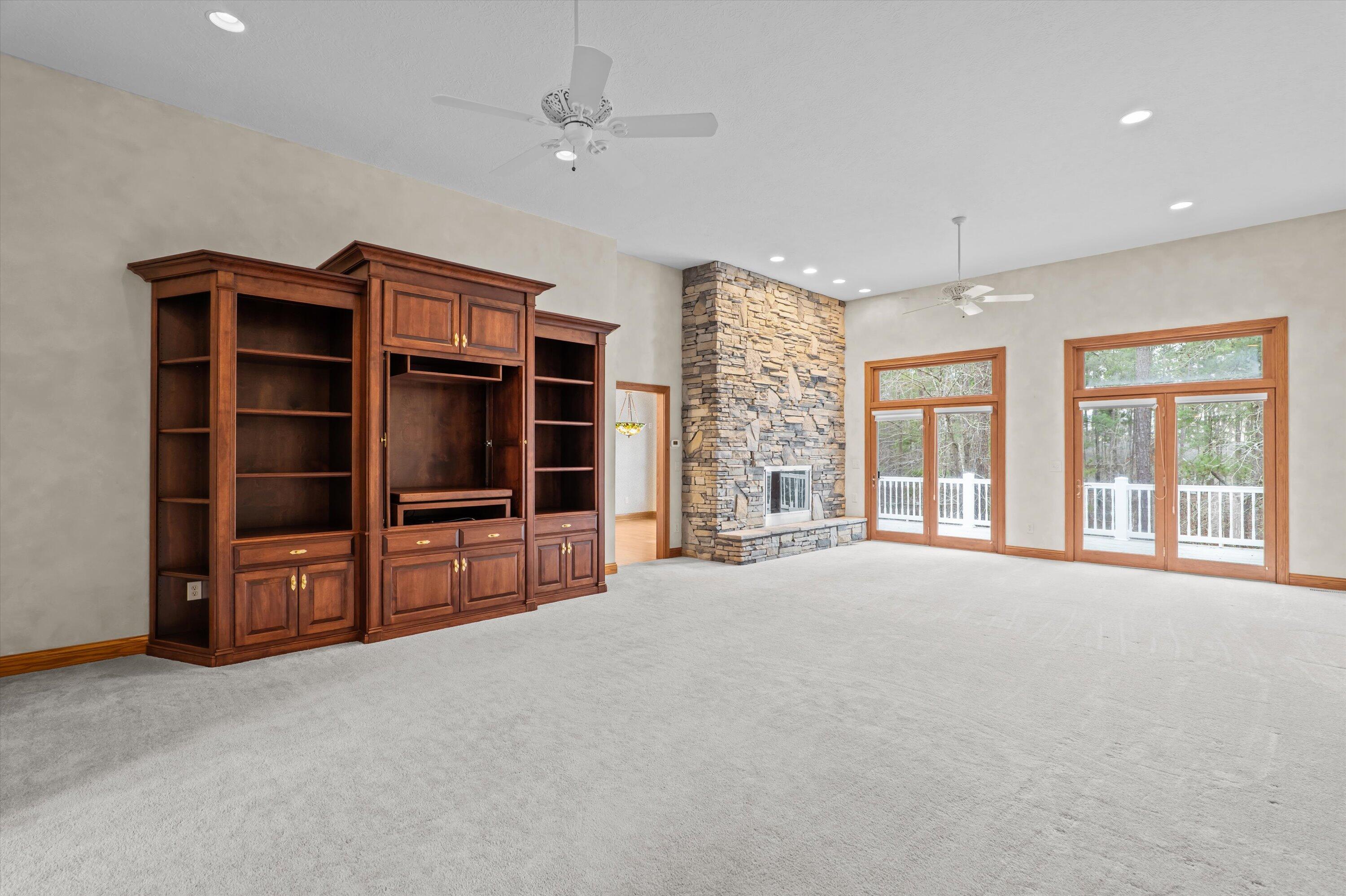 210 Daly Place McCormick, SC 29835 - Photo 10 of 58 Expansive living room with stone fireplace