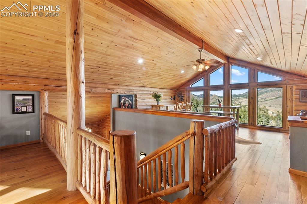 9110 Mountain Road Cascade, CO 80809 - Photo 23 of 49 a view of balcony with wooden floor and outdoor seating