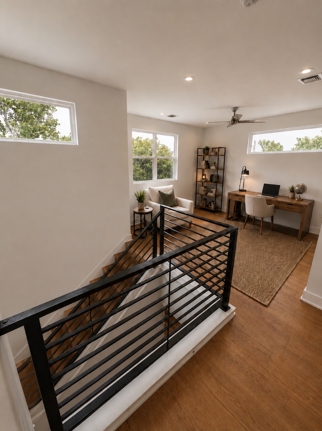 1719 Bunche Road Austin, TX 78721 - Photo 10 of 22 A versatile open loft with warm hardwood floors provides an inviting space for work or relaxation.