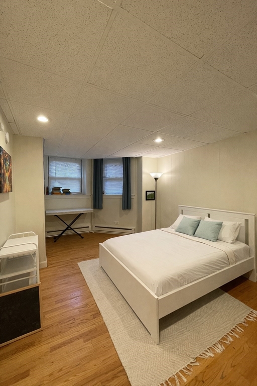 a bedroom with a large bed and a couch
