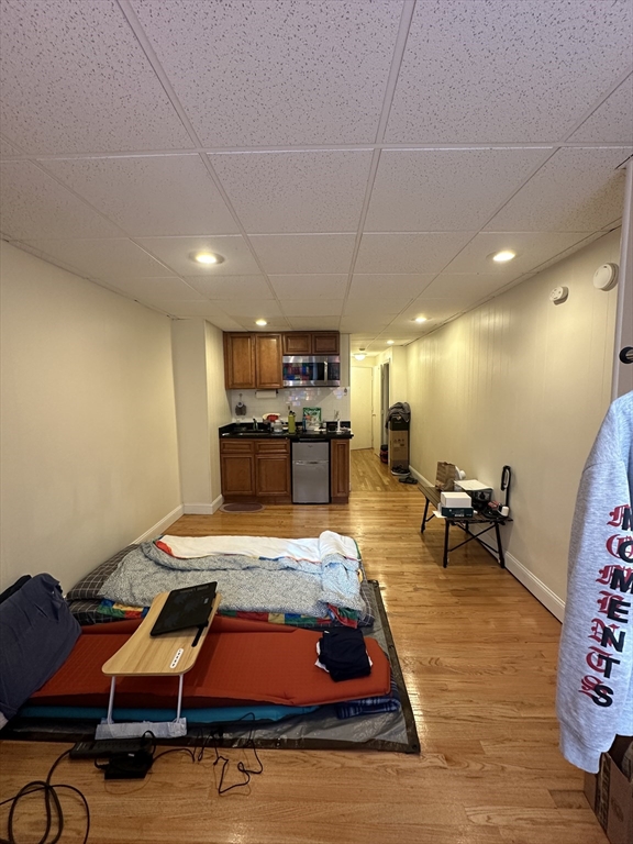 868 Beacon Street, Unit A Boston, MA 02215 - Photo 2 of 5 a room with furniture pool table and kitchen view