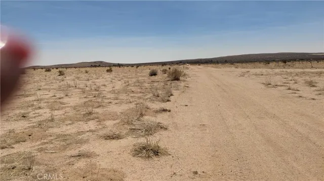 a view of wooden floor and a ocean view in back
