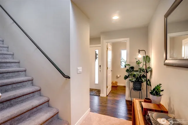 a view of entryway with wooden floor