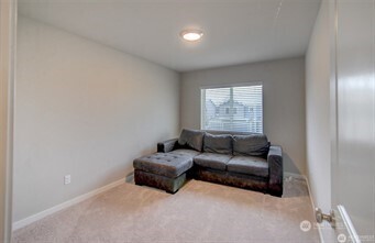 1326 11th Street Sultan, WA 98294 - Photo 17 of 31 a living room with furniture and a window