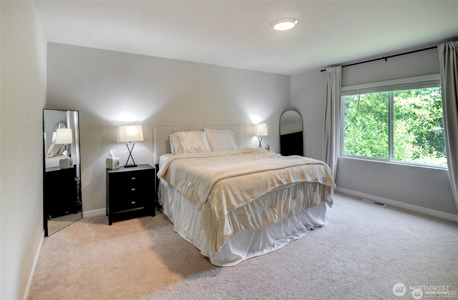 1326 11th Street Sultan, WA 98294 - Photo 22 of 31 a spacious bedroom with a bed and a large window