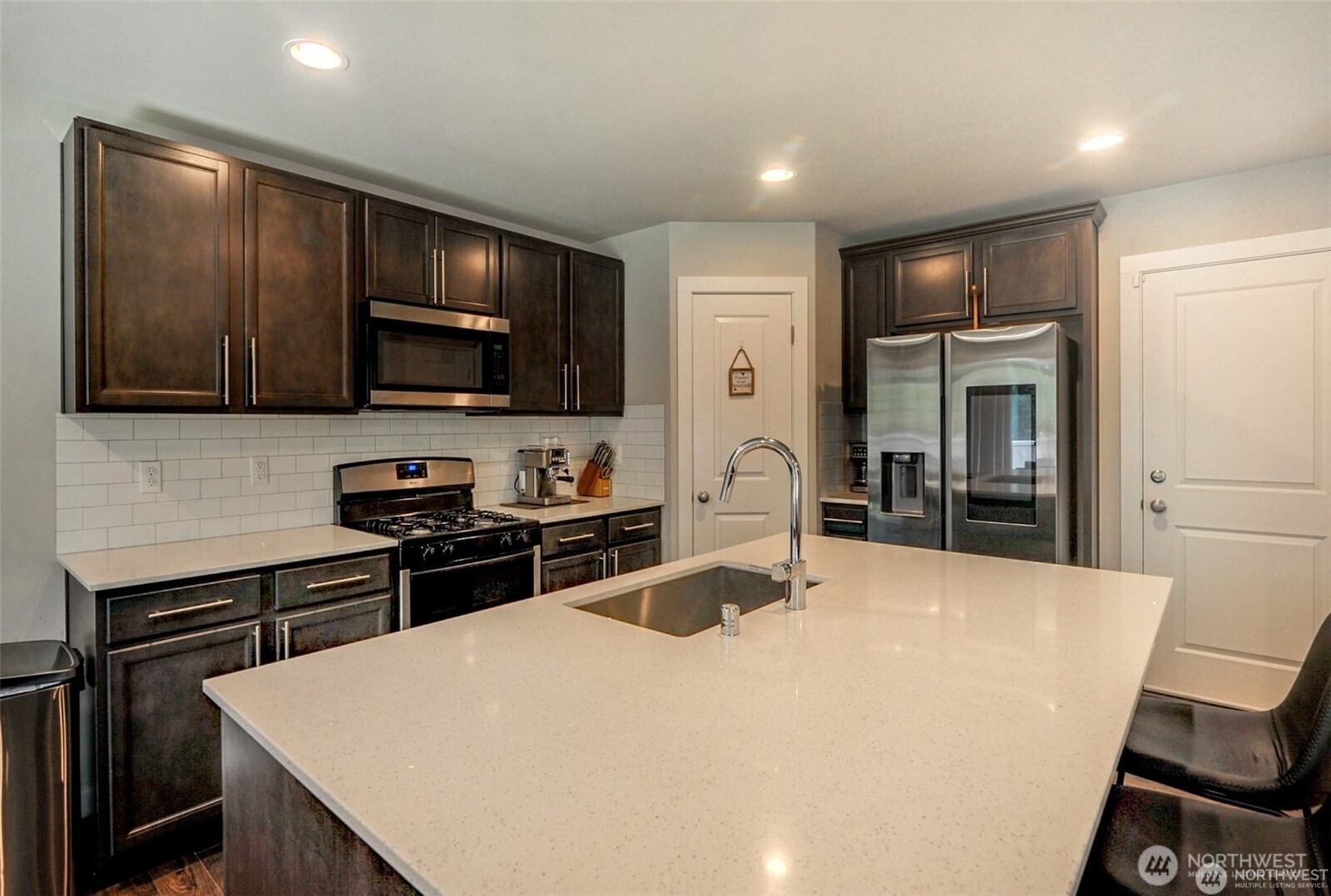 1326 11th Street Sultan, WA 98294 - Photo 7 of 31 a kitchen with a appliances a sink and cabinets