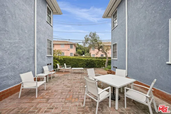 a outdoor space with a couch and chairs