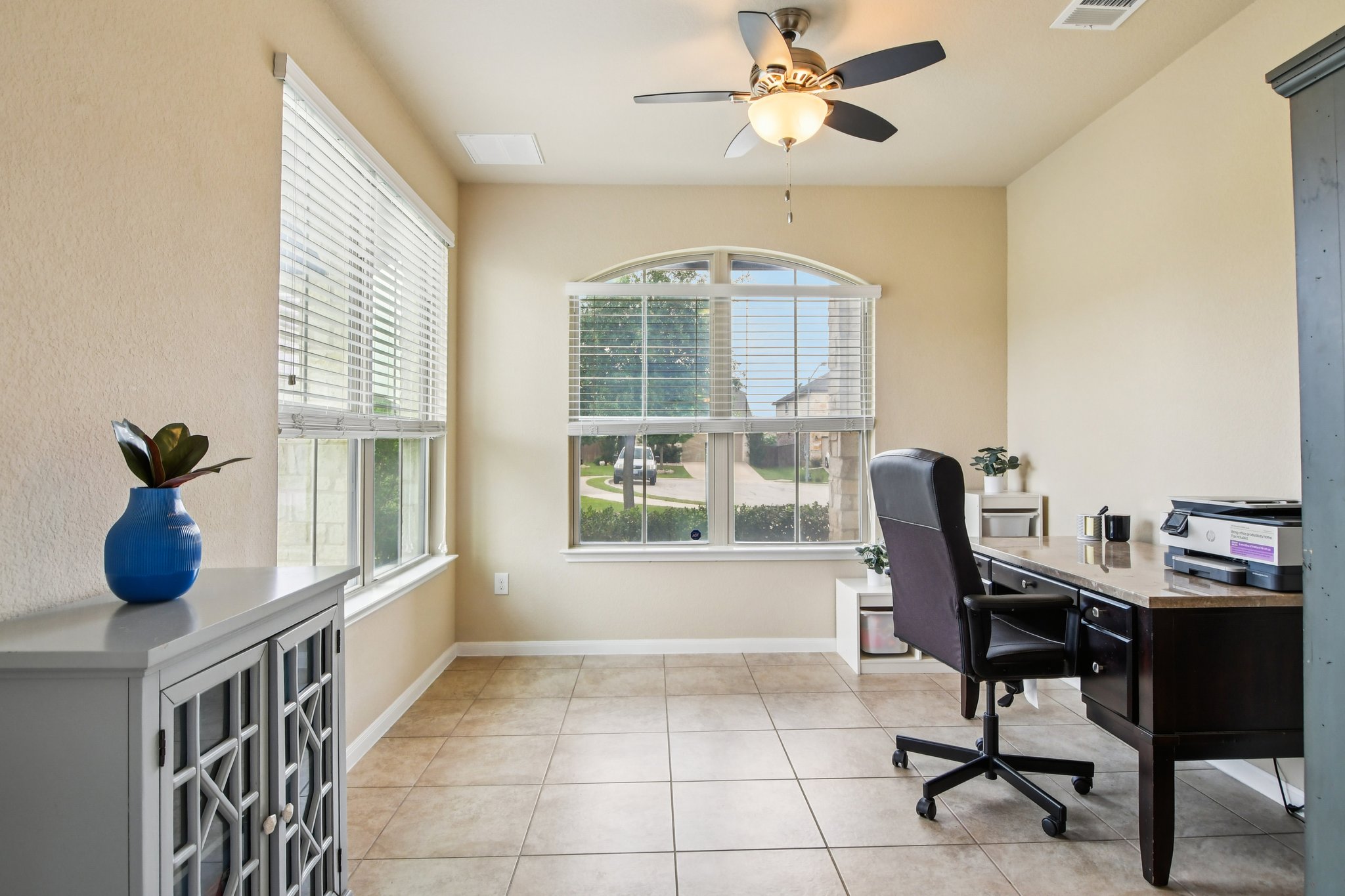 125 Checkerspot Court Georgetown, TX 78626 - Photo 14 of 40 a view of a workspace with furniture and a window