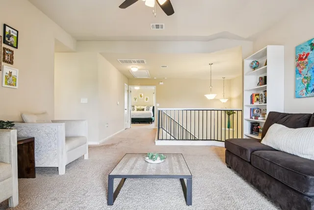 a living room with furniture and a rug
