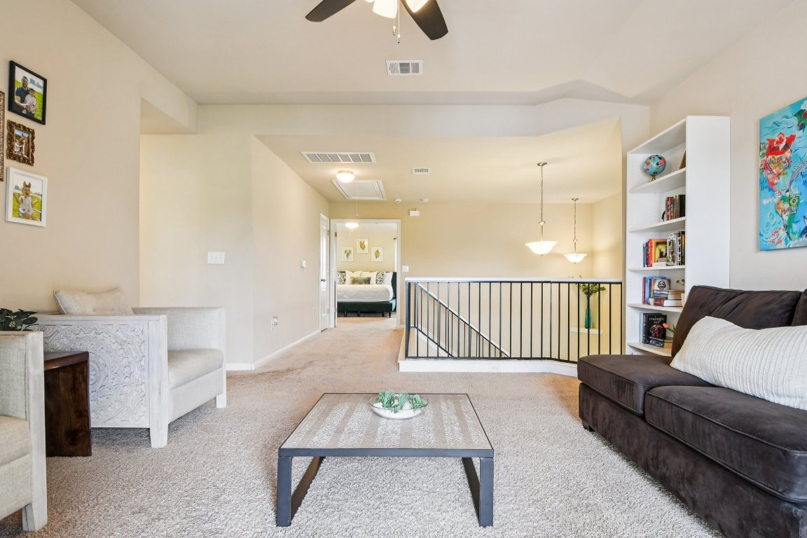 125 Checkerspot Court Georgetown, TX 78626 - Photo 22 of 40 a living room with furniture and a rug