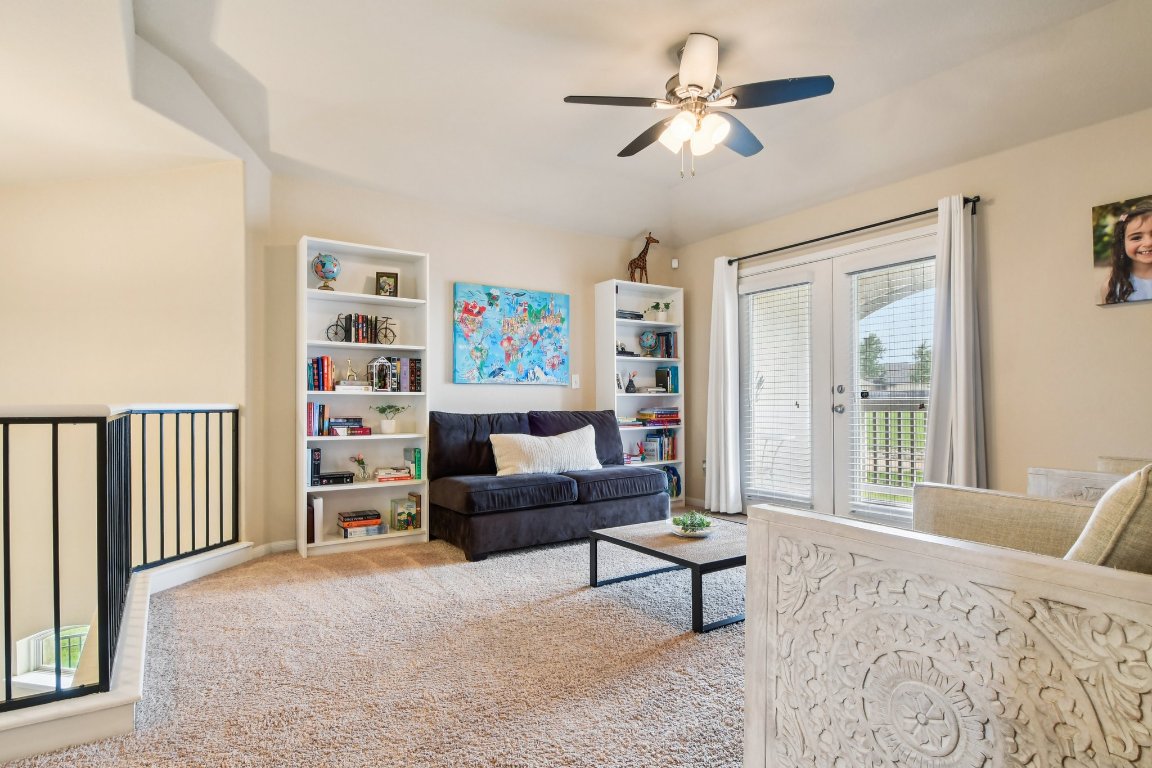 125 Checkerspot Court Georgetown, TX 78626 - Photo 23 of 40 a bedroom with furniture and a chandelier fan