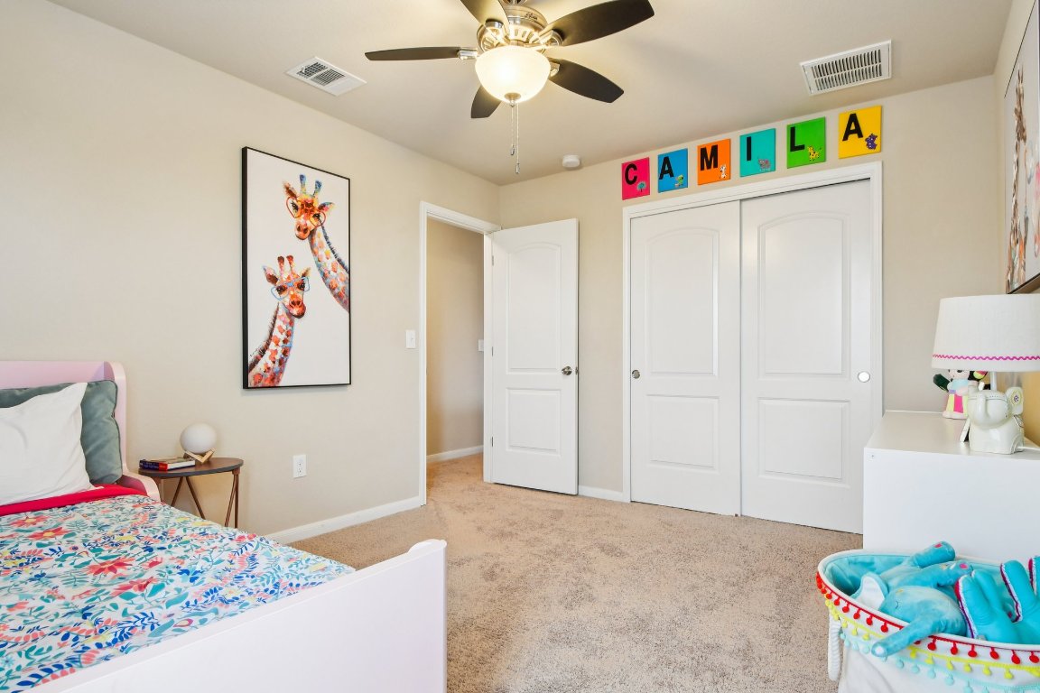 125 Checkerspot Court Georgetown, TX 78626 - Photo 25 of 40 a very nice looking bedroom with a bed dresser and a couch