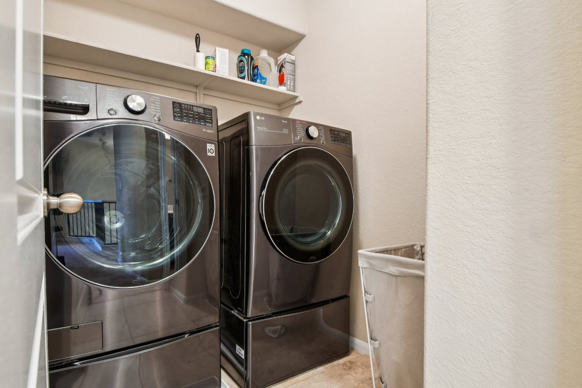 125 Checkerspot Court Georgetown, TX 78626 - Photo 26 of 40 a utility room with dryer and washer