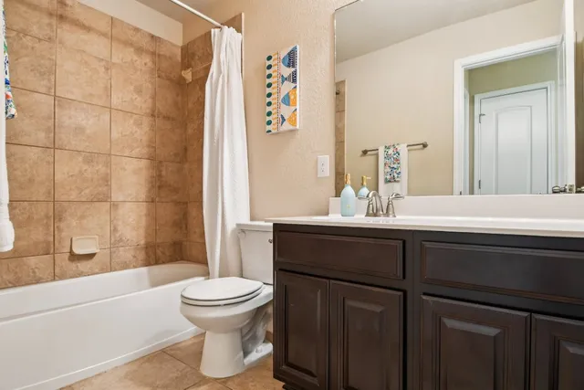 a bathroom with a sink a toilet and a bathtub