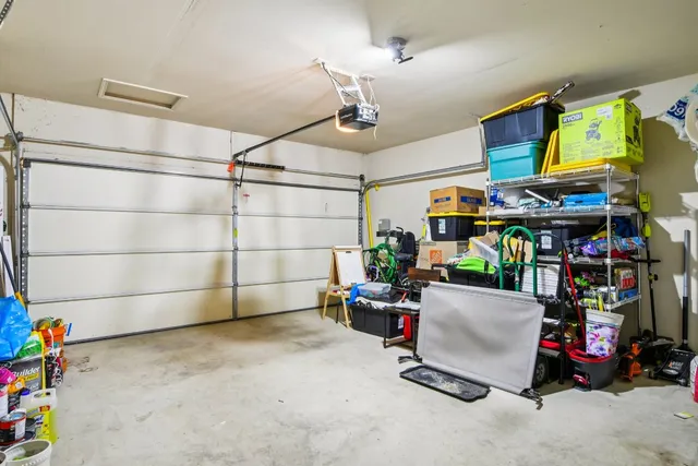 a room with lots of white furniture and a store