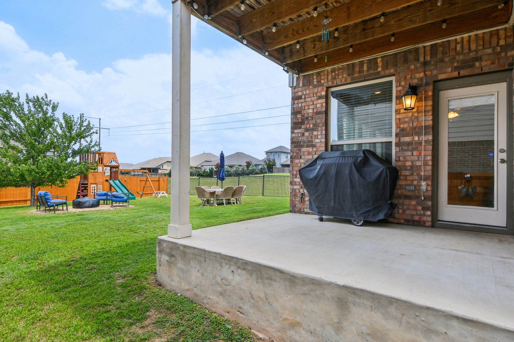 125 Checkerspot Court Georgetown, TX 78626 - Photo 37 of 40 a view of a chair and table in the back yard of the house