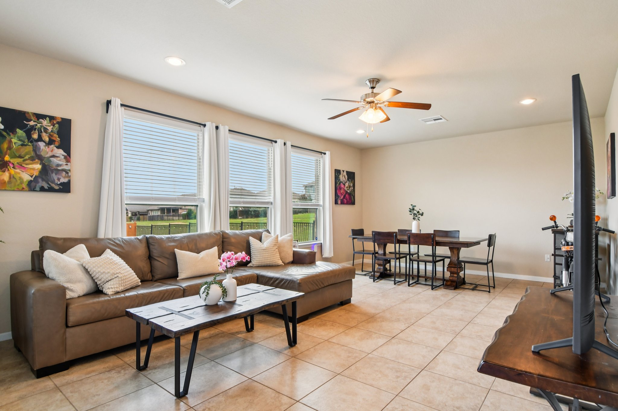125 Checkerspot Court Georgetown, TX 78626 - Photo 4 of 40 a living room with furniture and a dining table