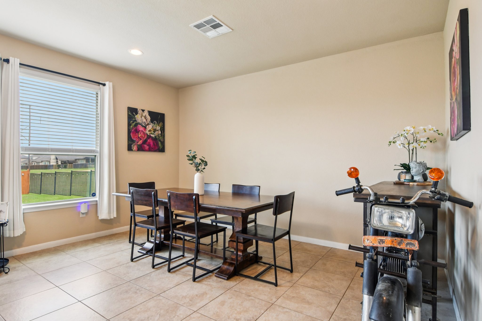 125 Checkerspot Court Georgetown, TX 78626 - Photo 7 of 40 a view of a dining room with furniture and a window