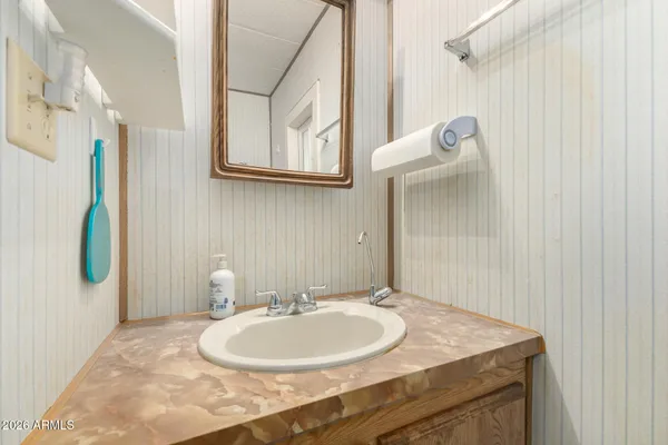a bathroom with a sink and a mirror
