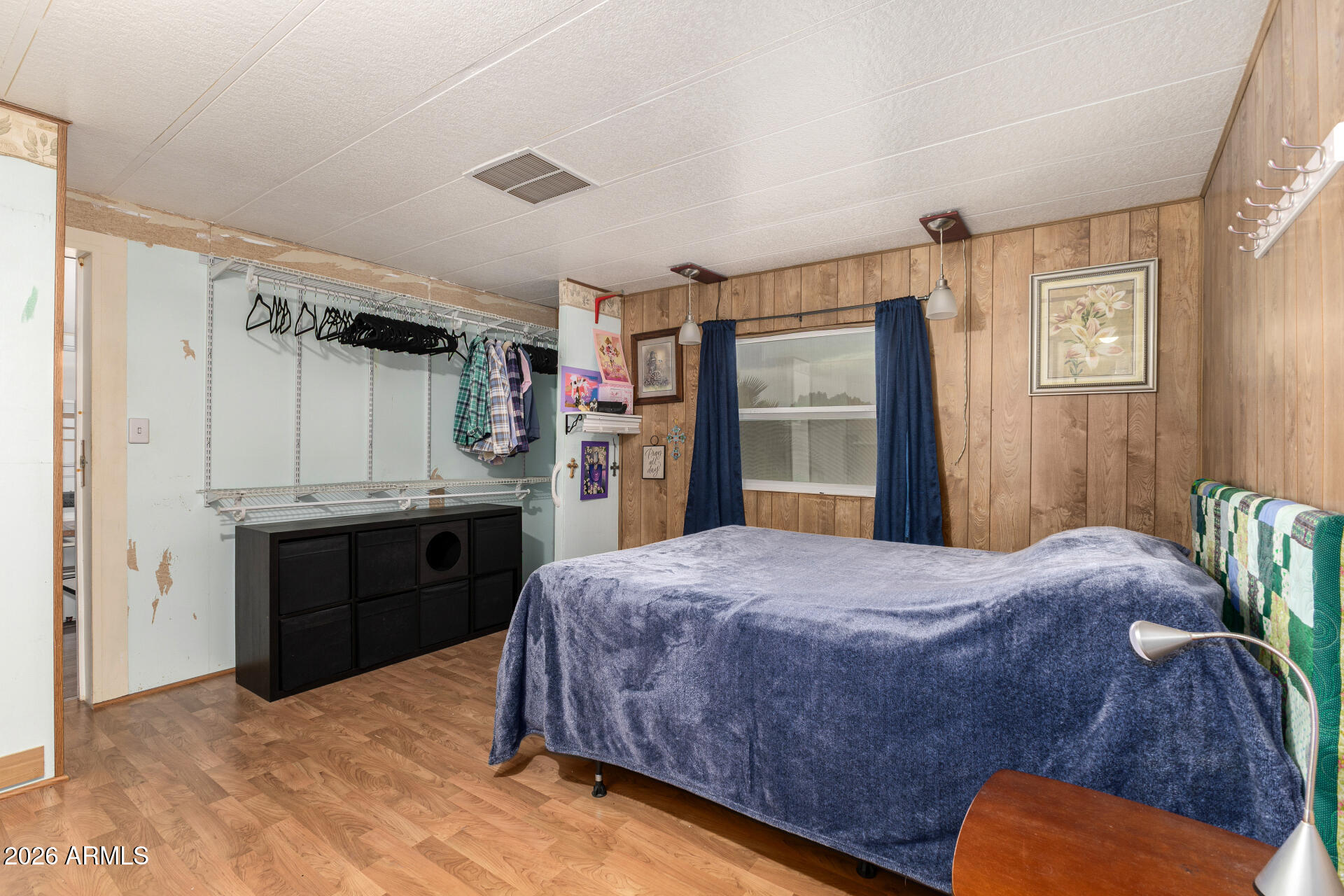 834 South Meridian Road, Unit 144 Apache Junction, AZ 85120 - Photo 18 of 43 a bedroom with a bed dresser and a window