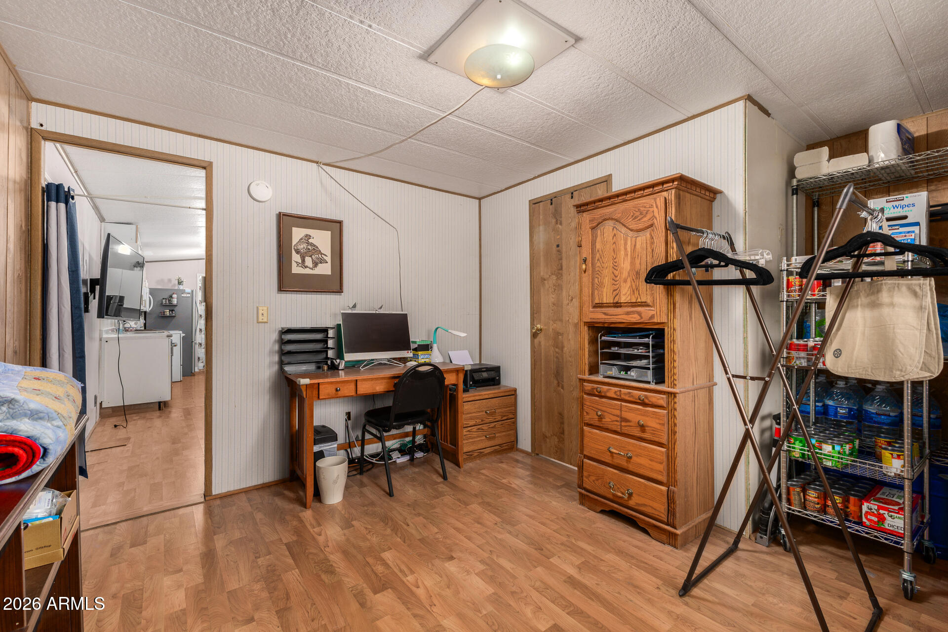 834 South Meridian Road, Unit 144 Apache Junction, AZ 85120 - Photo 22 of 43 a view of a workspace with furniture and a livingroom